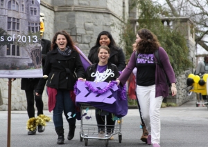 Sigma Sigma Sigma members with a shopping cart float 2013